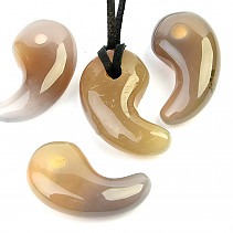 Agate tooth pendant on skin