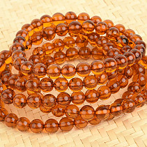 Bracelet made of amber in the shade of honey, balls 7 mm