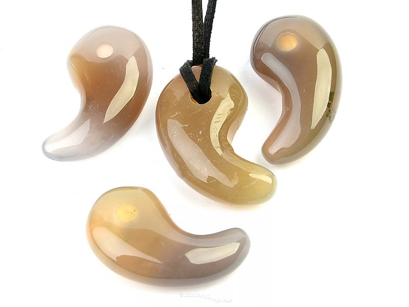 Agate tooth pendant on skin