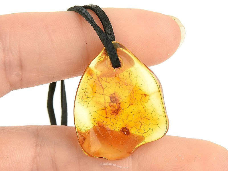 Pendant with amber on black leather 2.2g