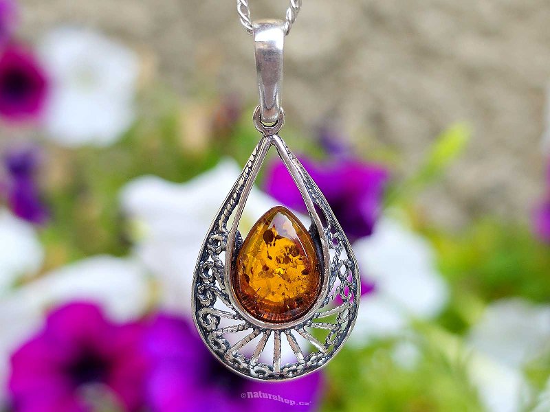 Amber honey pendant decorated with silver Ag 925/1000