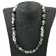 Crystal necklace with Ag inclusions fastening smooth stones
