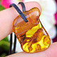Pendant with amber on leather 2.7g