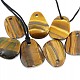 Tiger eye shaped pendant on the leather